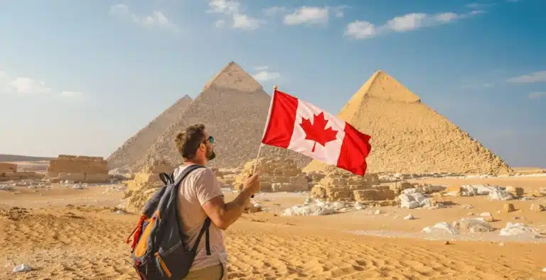 A-stunning-image-of-a-soldier-traveler-holding-his-country’s-flag-and-standing-in-front-of-the-pyramids.